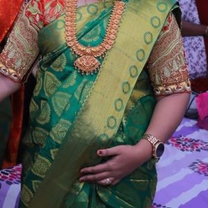 dark green silk saree with or without red colored heavy work blouse
